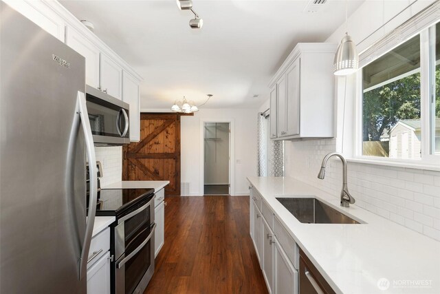 11950 SE 253rd St, Kent, WA 98030 - kitchen with stainless steel appliances, backsplash, light countertops, and white cabinets