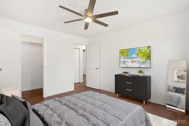 11950 SE 253rd St, Kent, WA 98030 - bedroom featuring wood finished floors, a spacious closet, and ceiling fan