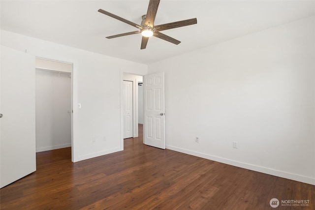 11950 SE 253rd St, Kent, WA 98030 - unfurnished bedroom with wood finished floors, a walk in closet, and a ceiling fan