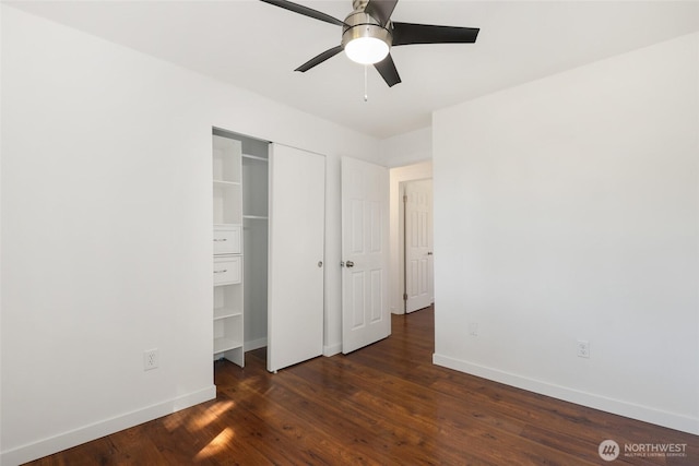 11950 SE 253rd St, Kent, WA 98030 - unfurnished bedroom with dark wood finished floors, a ceiling fan, and a closet