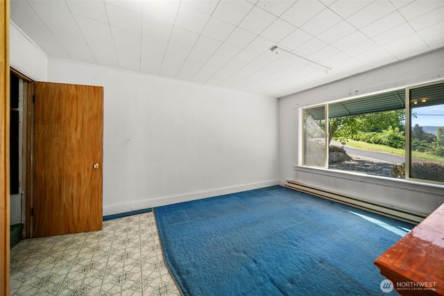 2301 NW Cascade Ave, East Wenatchee, WA 98802 - spare room featuring a baseboard heating unit and track lighting