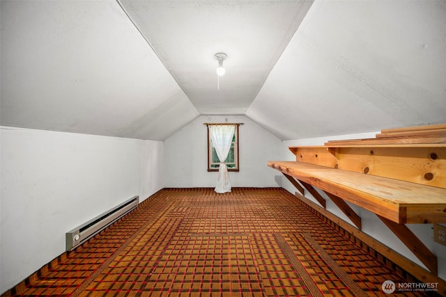 2301 NW Cascade Ave, East Wenatchee, WA 98802 - bonus room featuring a baseboard heating unit, vaulted ceiling, and carpet flooring