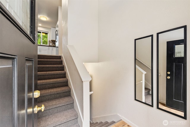 4133 23rd Ave SW, Seattle, WA 98106 - staircase featuring wood finished floors and baseboards