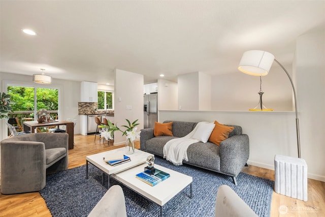 4133 23rd Ave SW, Seattle, WA 98106 - living room featuring light wood finished floors and recessed lighting