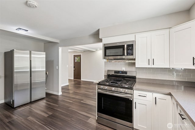 1524 26th Ave NE, Olympia, WA 98506 - kitchen featuring stainless steel appliances, dark wood-type flooring, tasteful backsplash, and white cabinetry