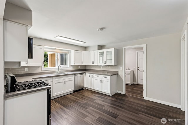 1524 26th Ave NE, Olympia, WA 98506 - kitchen with dishwasher, dark wood-type flooring, backsplash, white cabinetry, and glass insert cabinets