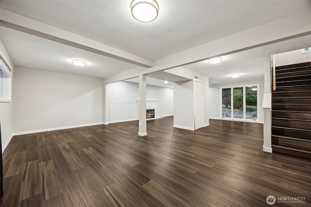 1524 26th Ave NE, Olympia, WA 98506 - below grade area with a warm lit fireplace, stairway, and wood finished floors