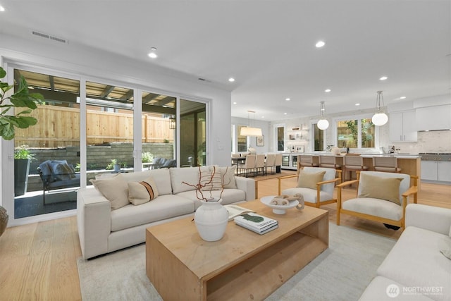 233 19th Ave, Kirkland, WA 98033 - living area with light wood-style flooring, recessed lighting, and beverage cooler