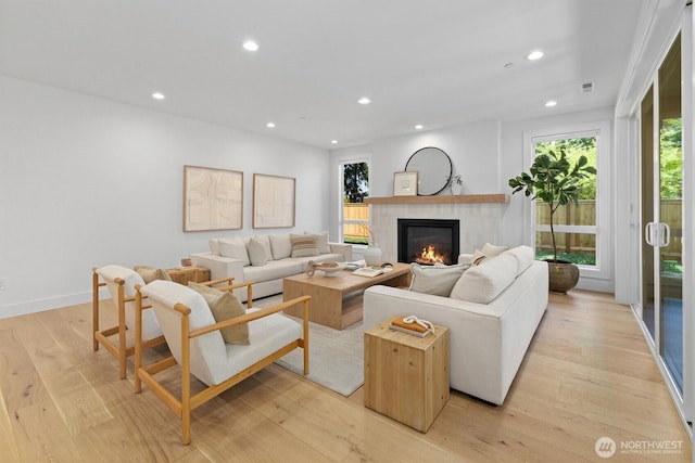 233 19th Ave, Kirkland, WA 98033 - living area with a glass covered fireplace, plenty of natural light, recessed lighting, and light wood finished floors