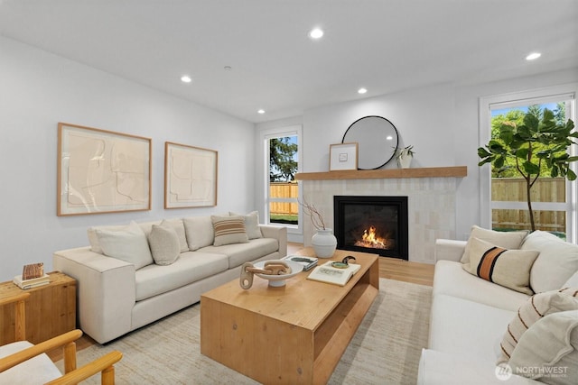 233 19th Ave, Kirkland, WA 98033 - living room featuring recessed lighting, a fireplace, plenty of natural light, and light wood-type flooring
