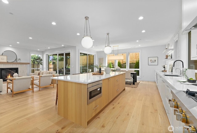 233 19th Ave, Kirkland, WA 98033 - kitchen with modern cabinets, stainless steel appliances, recessed lighting, light wood-style floors, and light brown cabinets