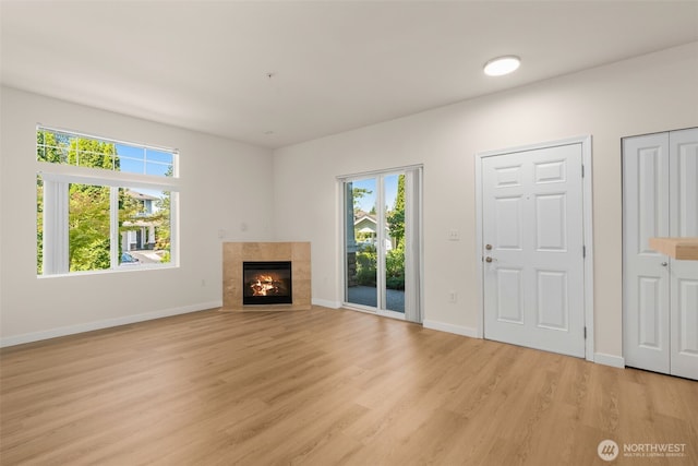 6409 Hazel Ln SE Unit H, Auburn, WA 98092 - unfurnished living room featuring light wood-style floors and a fireplace