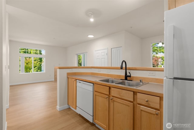 6409 Hazel Ln SE Unit H, Auburn, WA 98092 - kitchen with white appliances, light wood finished floors, plenty of natural light, light countertops, and recessed lighting