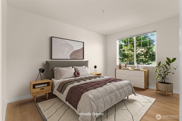 6409 Hazel Ln SE Unit H, Auburn, WA 98092 - bedroom featuring light wood-type flooring