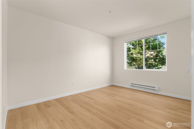 6409 Hazel Ln SE Unit H, Auburn, WA 98092 - spare room with baseboard heating and light wood finished floors