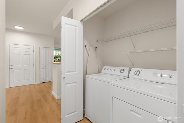 6409 Hazel Ln SE Unit H, Auburn, WA 98092 - washroom featuring separate washer and dryer and light wood-style floors