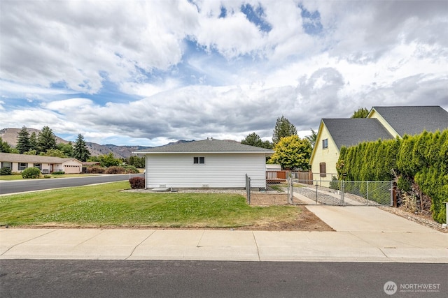 1312 Welch Ave, Wenatchee, WA 98801 - view of side of property featuring a gate and a mountain view