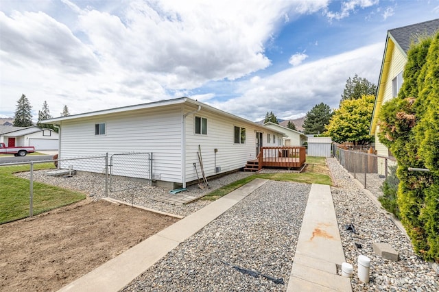 1312 Welch Ave, Wenatchee, WA 98801 - view of side of home featuring a wooden deck and a gate