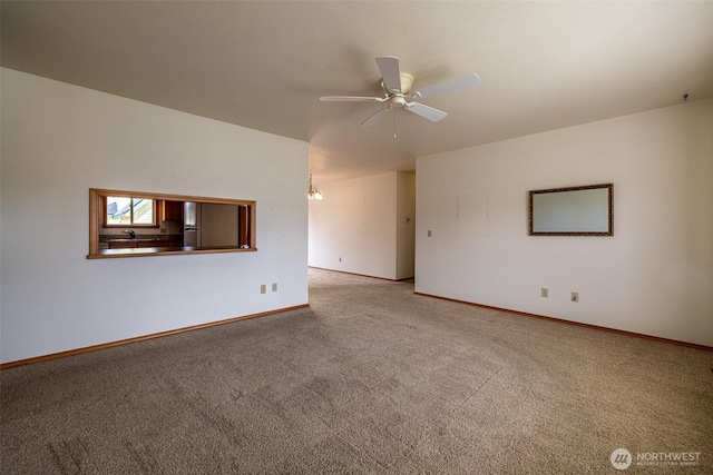 1312 Welch Ave, Wenatchee, WA 98801 - carpeted empty room featuring ceiling fan and baseboards