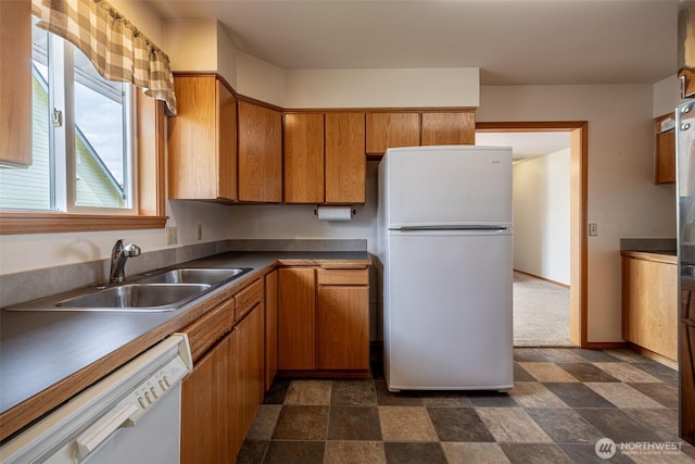 1312 Welch Ave, Wenatchee, WA 98801 - kitchen with white appliances, brown cabinetry, and dark stone finish floors