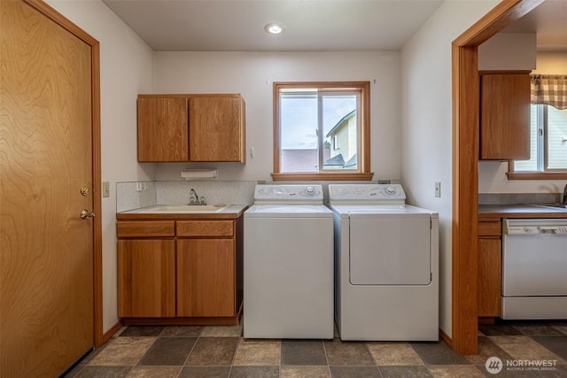 1312 Welch Ave, Wenatchee, WA 98801 - laundry room featuring washing machine and dryer, dark stone finish floors, and recessed lighting