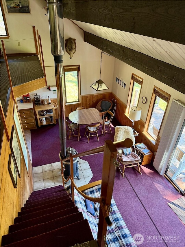 108 N Airport Way, Friday Harbor, WA 98250 - carpeted living room featuring wood walls, a wainscoted wall, healthy amount of natural light, and wooden ceiling