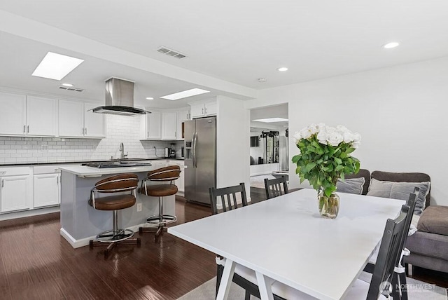 1501 58th Ave NE, Tacoma, WA 98422 - dining area featuring dark wood finished floors, recessed lighting, and a skylight