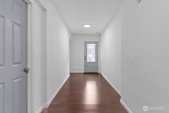 1501 58th Ave NE, Tacoma, WA 98422 - doorway to outside featuring wood finished floors and baseboards