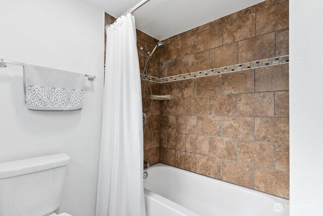 1501 58th Ave NE, Tacoma, WA 98422 - bathroom featuring shower / bath combination with curtain and toilet