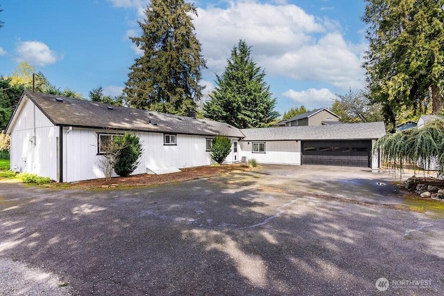1501 58th Ave NE, Tacoma, WA 98422 - view of front facade with a garage and asphalt driveway