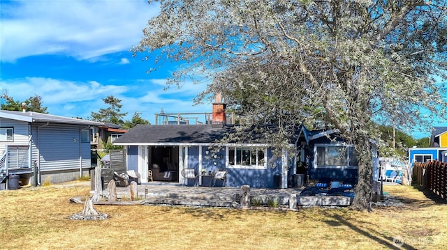 724 Walters Ln, Point Roberts, WA 98281 - view of front facade with a chimney and a patio