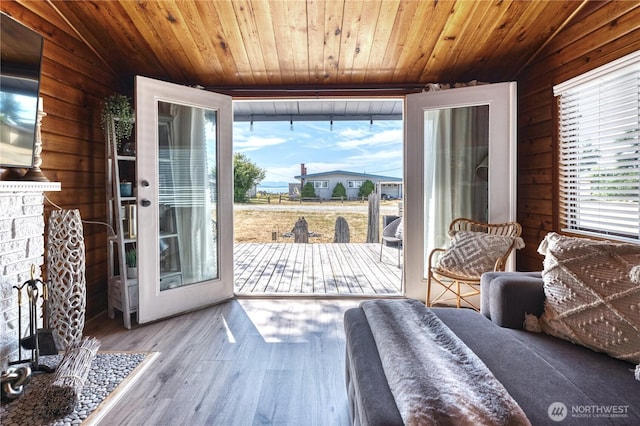 724 Walters Ln, Point Roberts, WA 98281 - bedroom with access to outside, wooden walls, wooden ceiling, wood finished floors, and vaulted ceiling