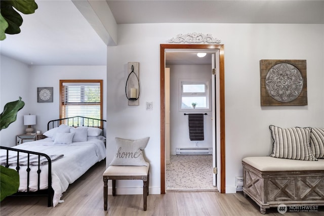 724 Walters Ln, Point Roberts, WA 98281 - bedroom featuring a baseboard heating unit, wood finished floors, and heating unit