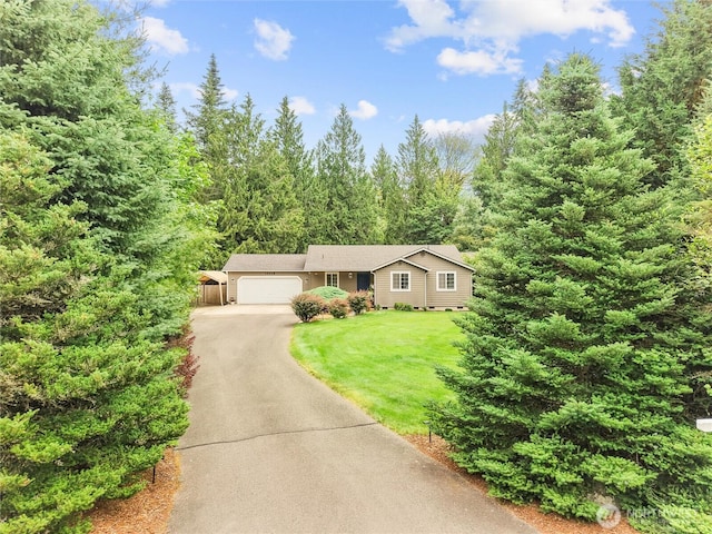 15428 Bornstein Ln SE, Yelm, WA 98597 - ranch-style home featuring an attached garage, asphalt driveway, crawl space, and a view of trees