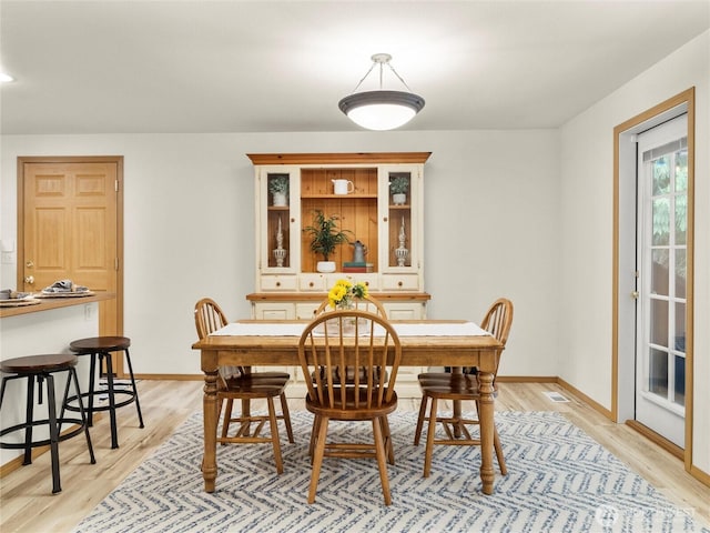 15428 Bornstein Ln SE, Yelm, WA 98597 - dining room with light wood-style flooring and baseboards
