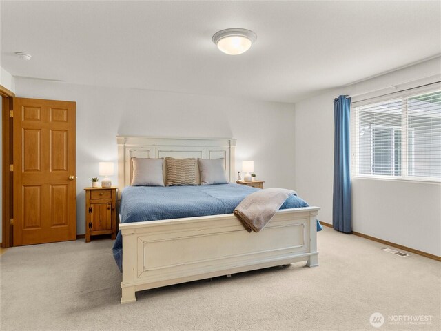15428 Bornstein Ln SE, Yelm, WA 98597 - bedroom featuring light colored carpet and baseboards