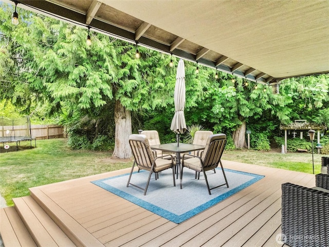 15428 Bornstein Ln SE, Yelm, WA 98597 - wooden deck featuring a trampoline and outdoor dining space