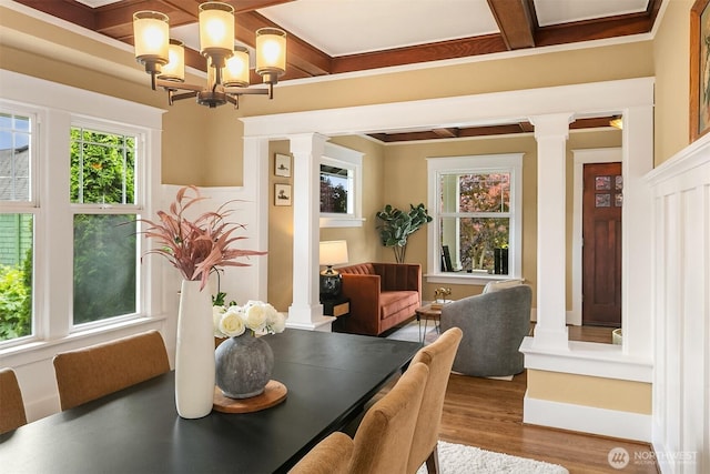 4010 Interlake Ave N, Seattle, WA 98103 - dining area featuring decorative columns, a chandelier, wood finished floors, beamed ceiling, and coffered ceiling