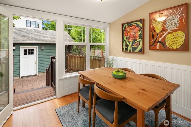 4010 Interlake Ave N, Seattle, WA 98103 - dining area featuring vaulted ceiling, wainscoting, and light wood-type flooring