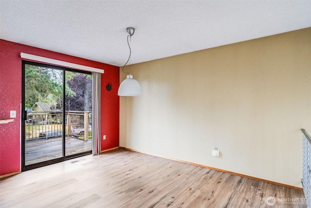 31107 11th Pl SW, Federal Way, WA 98023 - unfurnished dining area featuring light wood finished floors and baseboards