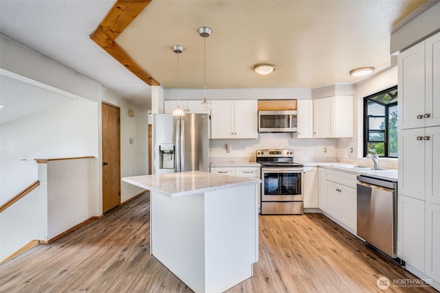 31107 11th Pl SW, Federal Way, WA 98023 - kitchen with stainless steel appliances, white cabinets, and light wood-type flooring