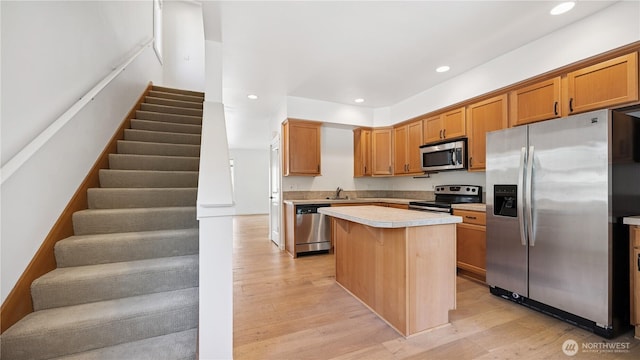 208 Sagebrook Ln, Cle Elum, WA 98922 - kitchen featuring appliances with stainless steel finishes, light countertops, a center island, recessed lighting, and light wood finished floors