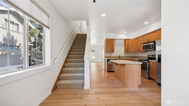 208 Sagebrook Ln, Cle Elum, WA 98922 - kitchen featuring appliances with stainless steel finishes, a kitchen island, light countertops, light wood-style floors, and recessed lighting