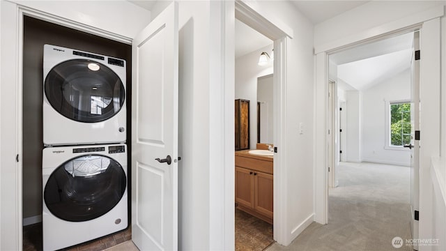 208 Sagebrook Ln, Cle Elum, WA 98922 - laundry area with stacked washing machine and dryer and light colored carpet