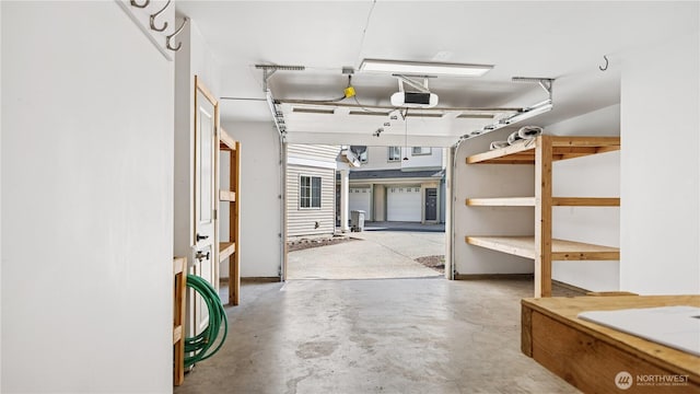 208 Sagebrook Ln, Cle Elum, WA 98922 - garage featuring a garage door opener and baseboards