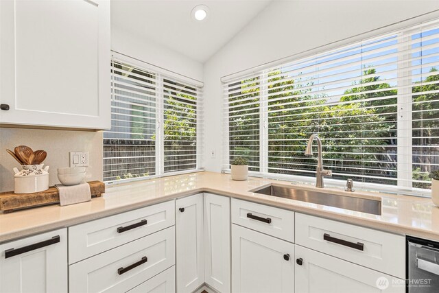 6401 146th Ave NE, Redmond, WA 98052 - kitchen with vaulted ceiling, white cabinetry, light countertops, dishwasher, and recessed lighting