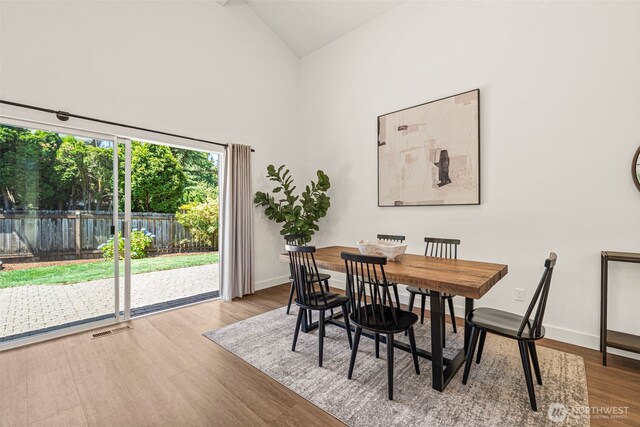 6401 146th Ave NE, Redmond, WA 98052 - dining space featuring wood finished floors and high vaulted ceiling