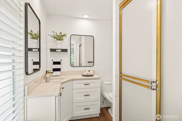 6401 146th Ave NE, Redmond, WA 98052 - bathroom featuring vanity, wood finished floors, and recessed lighting