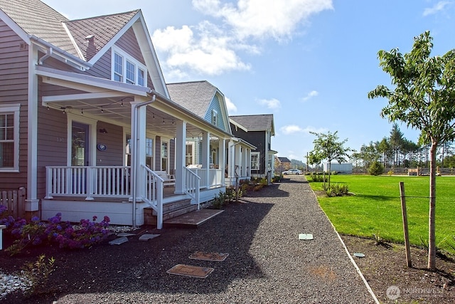 100 Horseshoe Ln, Pacific Beach, WA 98571 - view of property exterior featuring covered porch and a yard