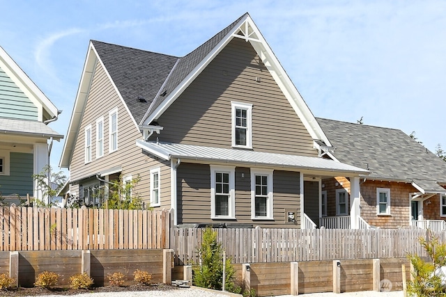 100 Horseshoe Ln, Pacific Beach, WA 98571 - view of front facade featuring covered porch, roof with shingles, and a metal roof